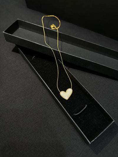 Zyro Luna Heart Pendant in white edition featuring a delicate heart-shaped design on a sleek chain.