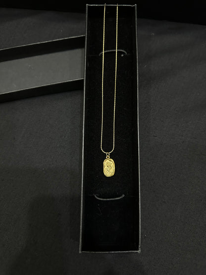 Gold leaf pendant by Zyro featuring a delicate, intricate design on a fine chain, perfect for elegant jewelry styling.