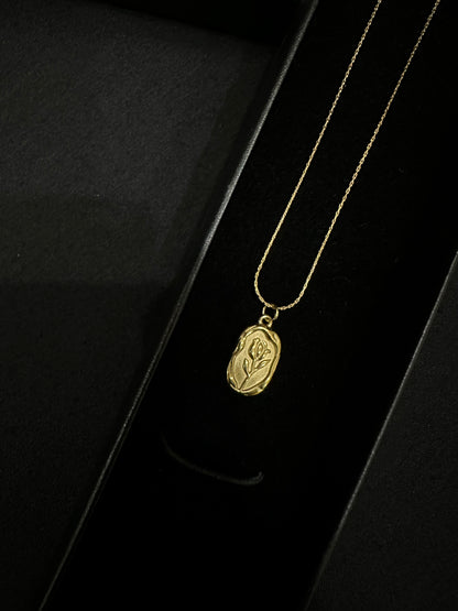 Golden leaf pendant by Zyro featuring a delicate, detailed gold leaf design on a chain.