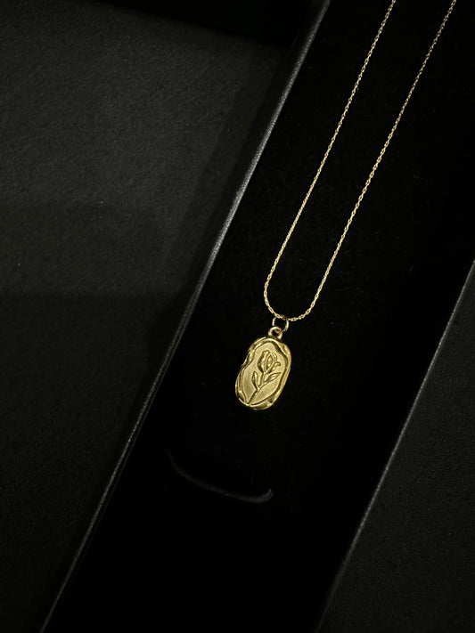 Golden leaf pendant by Zyro featuring a delicate, detailed gold leaf design on a chain.