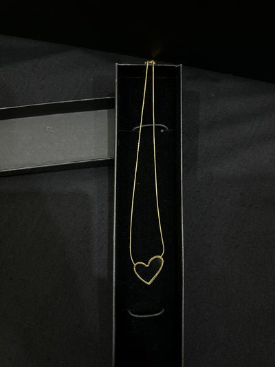 Black Luna Heart Pendant necklace by Zyro featuring a sleek heart-shaped design on a delicate chain.